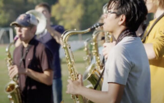 Student practicing the saxaphone in band